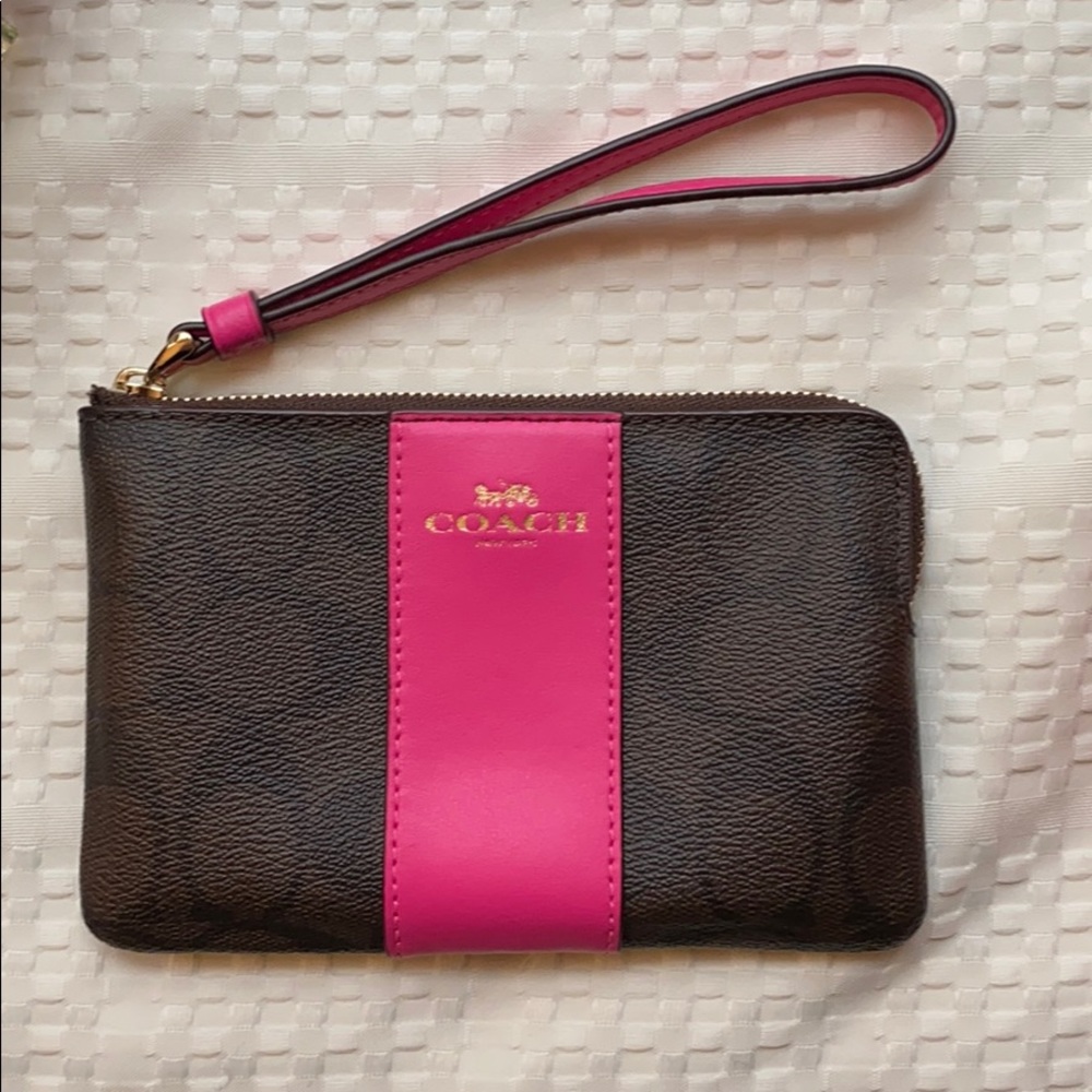 Brown and pink coach wristlet